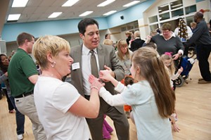 Senator Costa dances with students